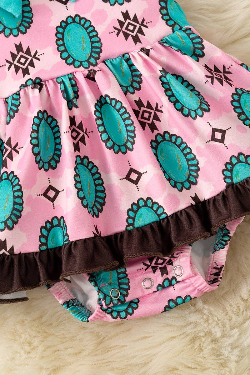 Aztec & concho printed on pink baby bodysuit. RPG60876 JEAN: 3-6M