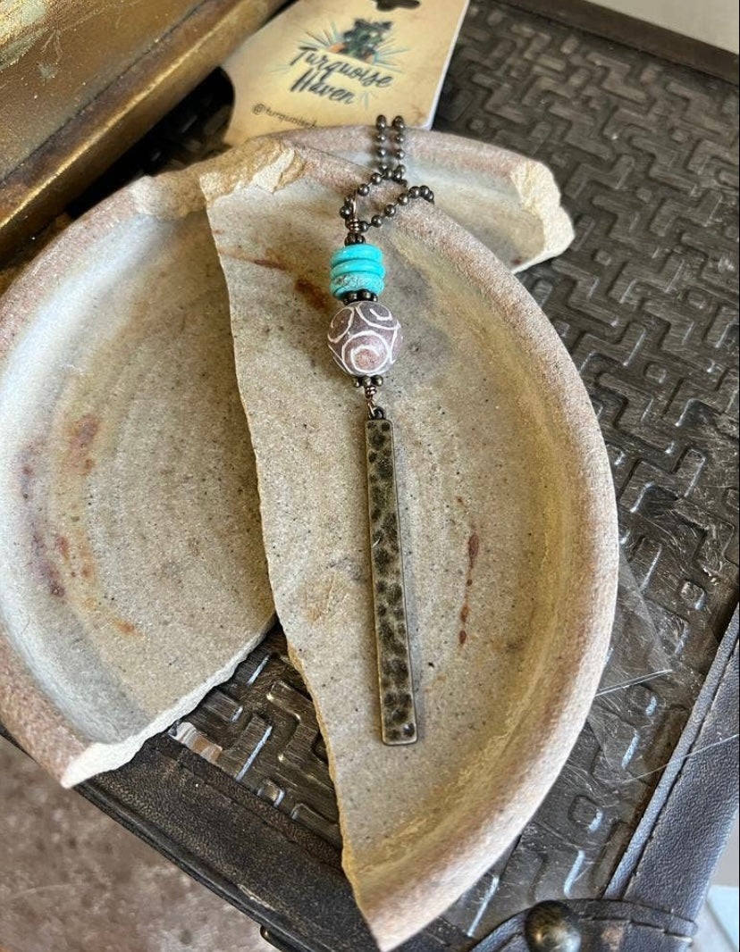 Turquoise stone necklace with metal drop